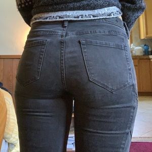 Black washed jeans with zipper pockets